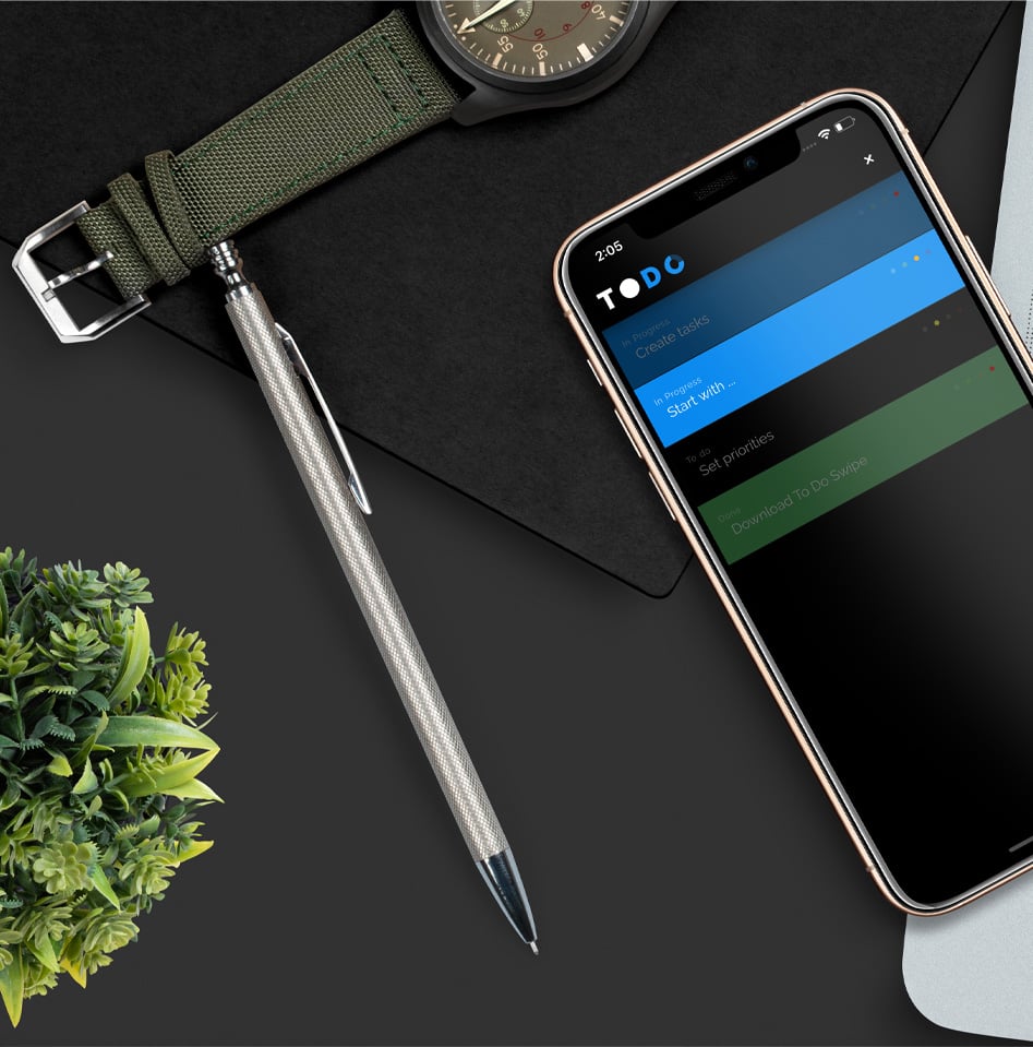 To Do Swipe app on iPhone with a watch and a notebook